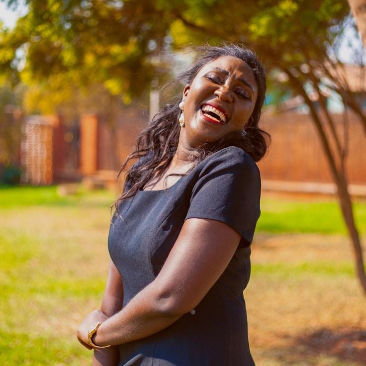 Kaveri Mehta, Lead Design Curator at Clear Market Drive, reviewing corporate floral arrangements
